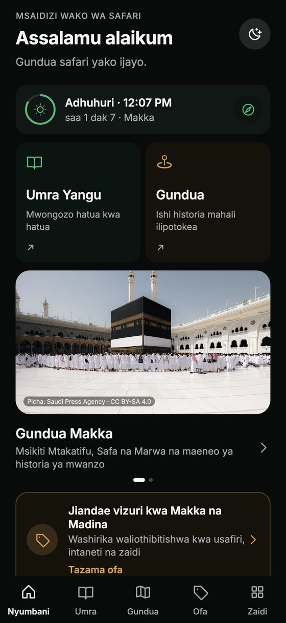 Ukurasa wa mwanzo wa programu ya Hijaza wenye nyakati za swala, „Umra Yangu“ na „Gundua“